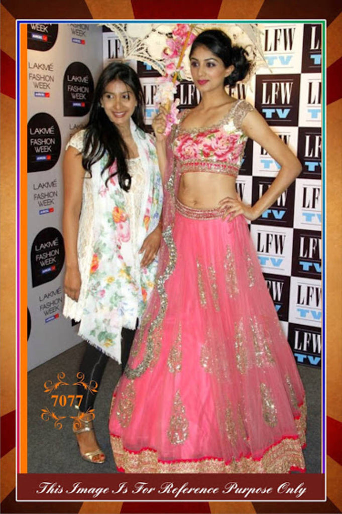 Pink net lehenga with net dupatta and raw silk blouse