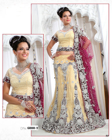 Dazzle in this white base pink yellow lehenga choli crafted in net